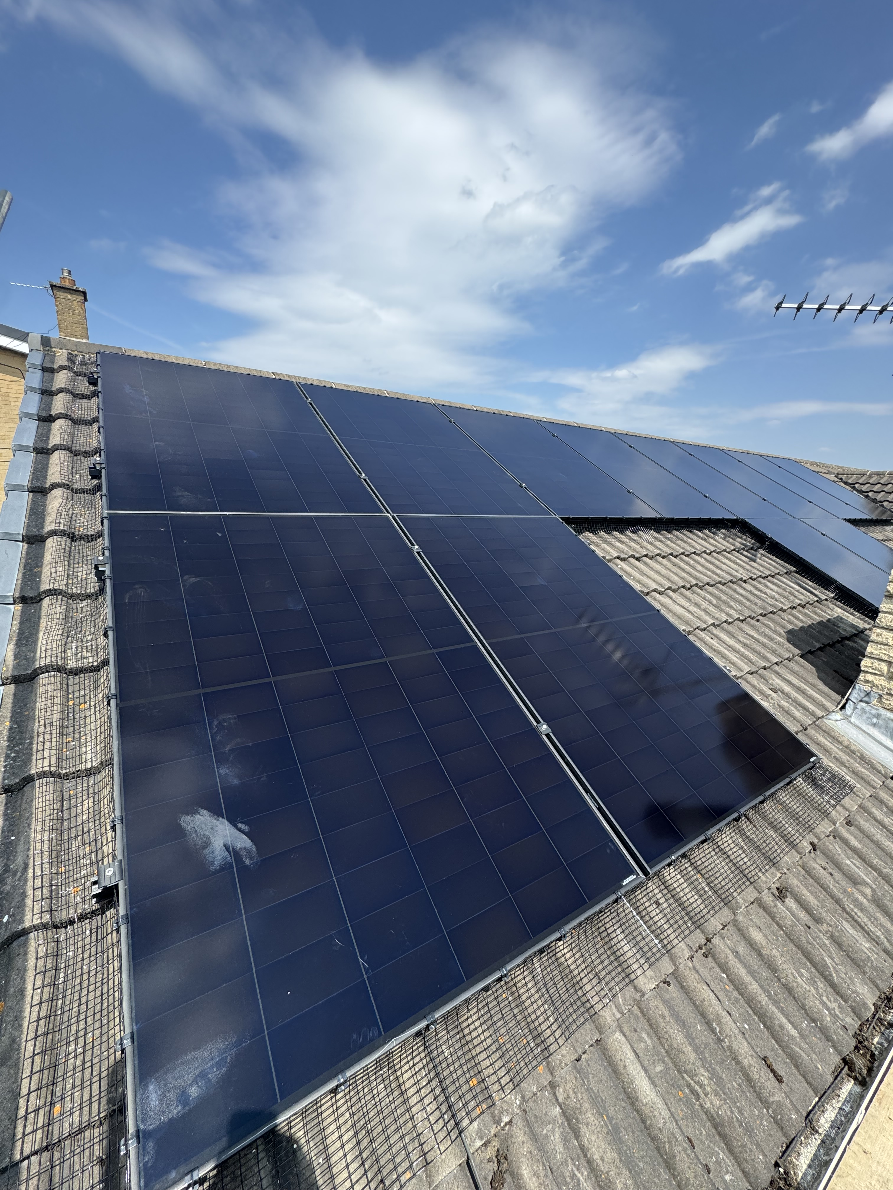 Solar panels with bird guard on a sloped roof