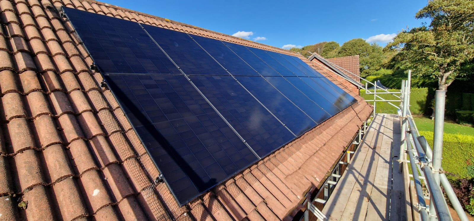 14 Black on Black panels mounted on a sloping roof
