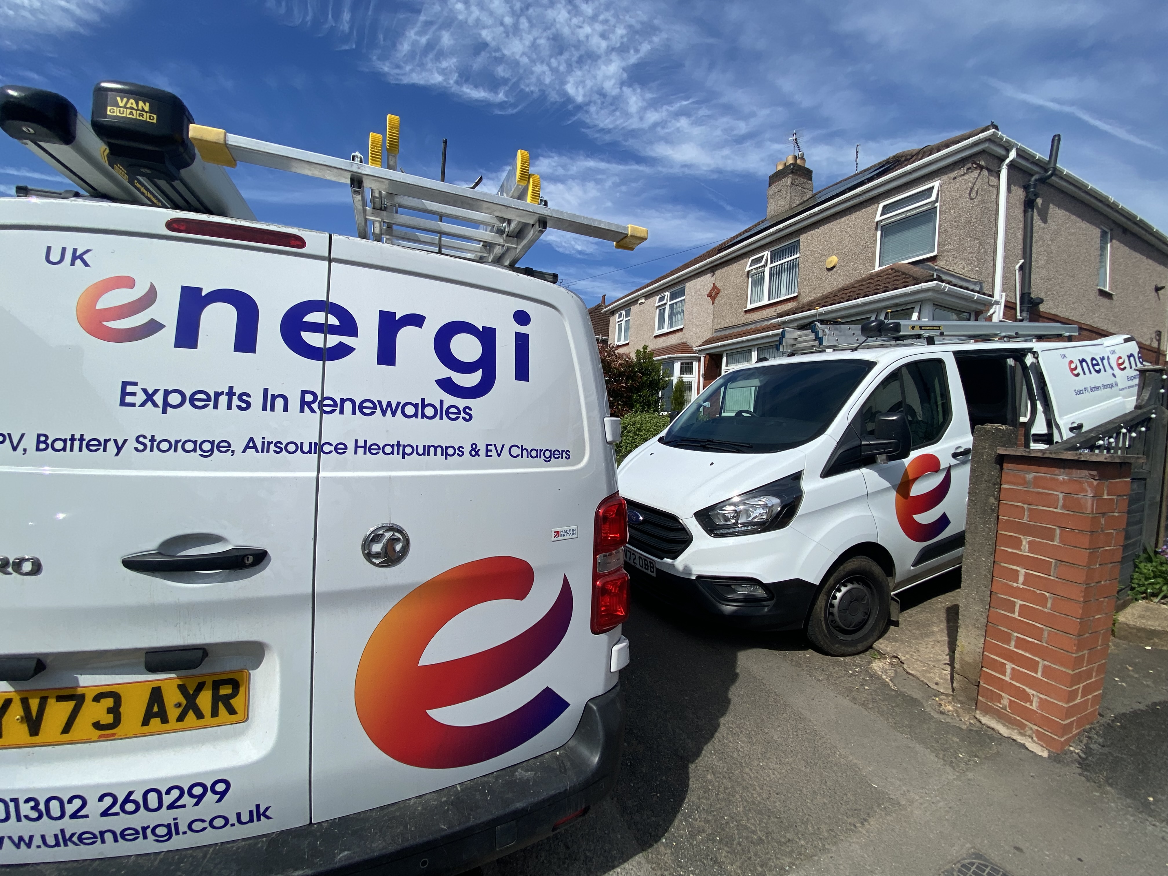 2 UK Energi Vans outside a semi-detached home